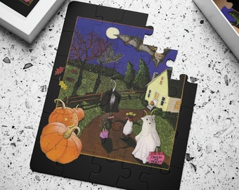 May include: A black jigsaw puzzle with a Halloween theme. The puzzle shows a house with a porch light, a ghost holding a bag that says "Trick or Treat", and a pumpkin. The puzzle is set against a dark blue background with a full moon and stars.