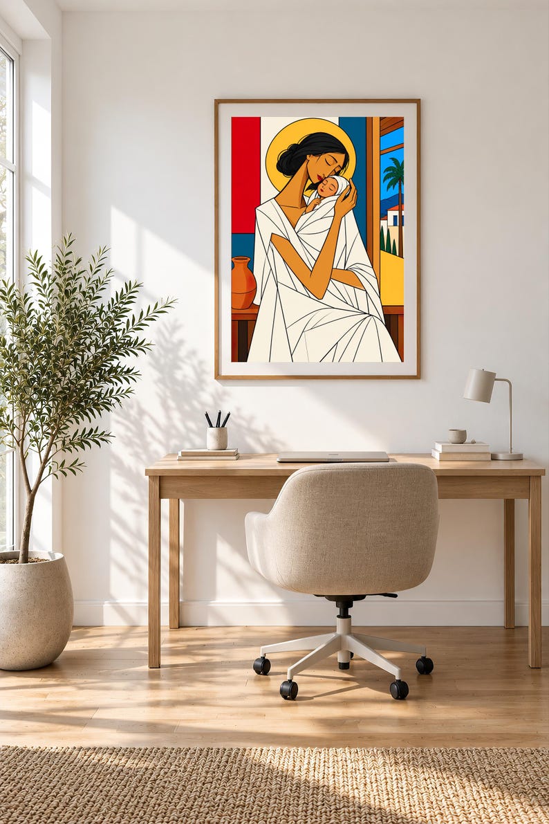 May include: A framed wall art print featuring a stylized illustration of a person with dark hair holding a baby. The figure wears a white garment with geometric lines. The background includes a yellow halo, red and blue panels, and a palm tree.