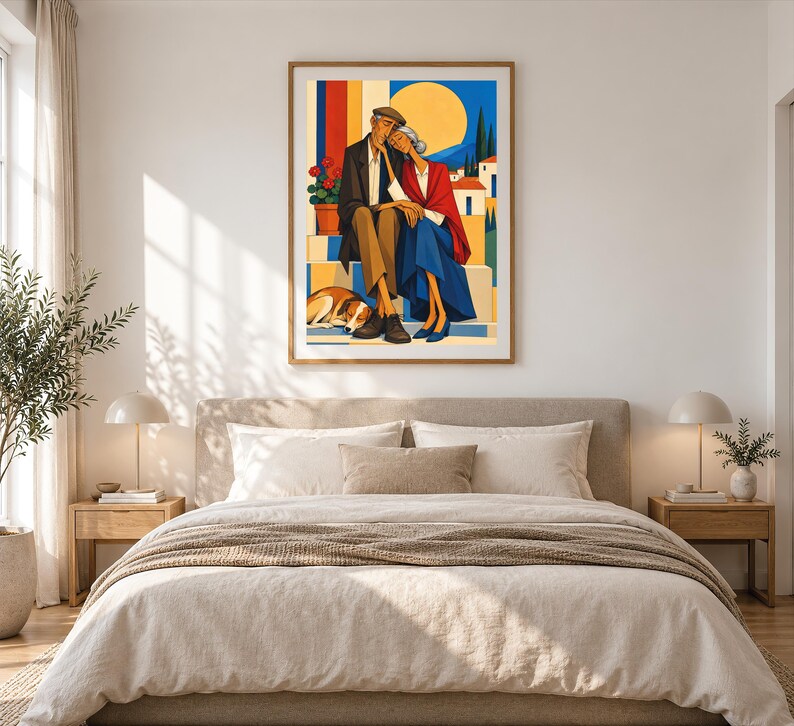 May include: A framed wall art print depicting an elderly couple sitting together on steps with a dog resting at their feet. The scene features a bright yellow sun, blue sky, and a potted plant with red flowers against a colourful architectural backdrop.