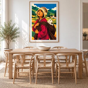 May include: A framed wall art print featuring a stylized illustration of a person wearing a red jacket and a patterned knit hat with pom-poms, carrying a small white puppy in a brown fabric sling against a backdrop of green hills and mountains.
