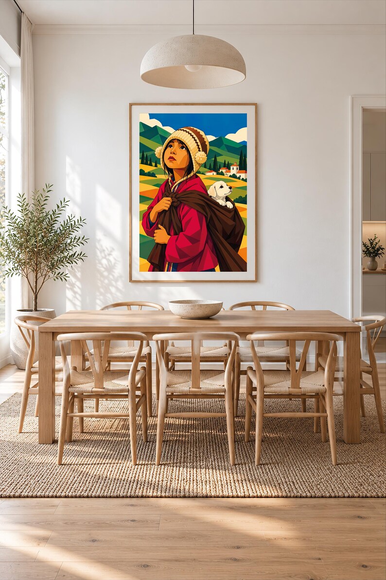 May include: A framed wall art print featuring a stylized illustration of a person wearing a red jacket and a patterned knit hat with pom-poms, carrying a small white puppy in a brown fabric sling against a backdrop of green hills and mountains.