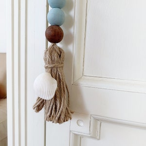 2 Drawer pulls with seashells, Coastal door hanging, Farmhouse door hanger, Sea blue wooden bead garland, Door knob tassel, Doorknob tassel