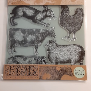 May include: Clear plastic sheet with farm animal decor stamps. The stamps include a rabbit, rooster, cow, sheep, and pig. The packaging reads "IRON ORCHID DESIGNS" and "FARM ANIMALS". Includes bonus reusable masks.