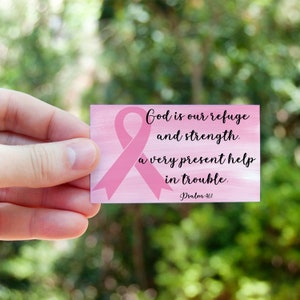 May include: A pink card with a pink ribbon and the text "God is our refuge and strength. A very present help in trouble. Psalm 46:1"