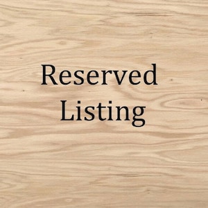 May include: A light-colored wood grain background with a smooth, natural texture featuring prominent horizontal patterns and knots. Centered in the middle of the image, the text Reserved Listing is printed in a simple, black, serif font.