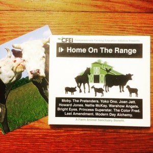 May include: A CD case with the title "Home On The Range" featuring a barn illustration and animal silhouettes. A photograph of two cows is to the left. The CD case lists artists including Moby, Yoko Ono, and Joan Jett.