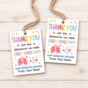 May include: Two rectangular white gift tags with jute twine strings. The tags feature colorful text reading THANK YOU for the difference you make EVERY SINGLE DAY! HAPPY RESPIRATORY CARE WEEK! From: Your Name, with lung and stethoscope icons.