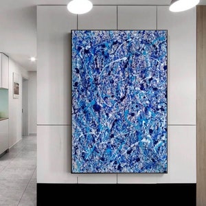 May include: Abstract painting with a blue, white, and black color scheme. The painting features a variety of brushstrokes and splatters of paint.