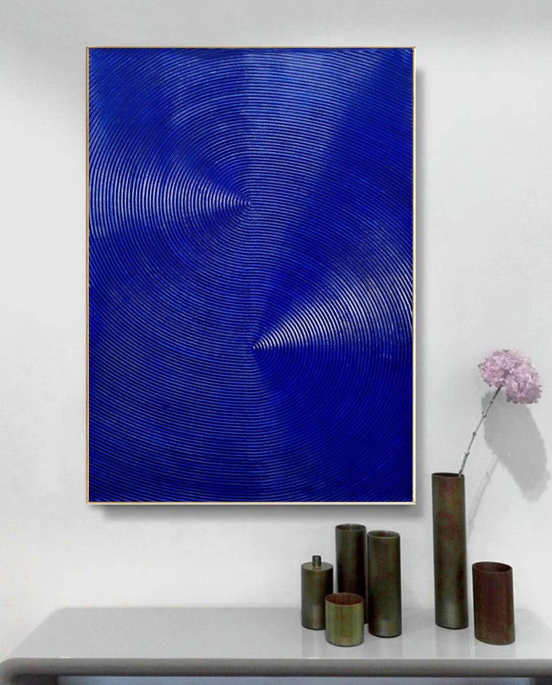 May include: Abstract painting with a blue background and concentric circles in a textured pattern.