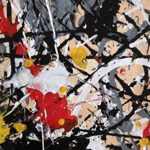 May include: Abstract painting with black, white, red, and yellow paint splatters on a beige canvas. The paint is applied in a random, chaotic pattern, creating a dynamic and energetic composition.