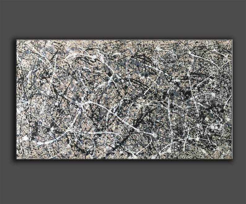 May include: Abstract painting with black, white and grey paint splatters and lines on a beige canvas.