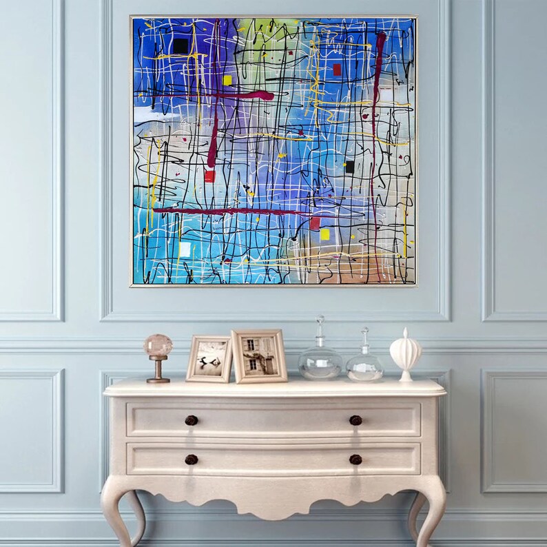 May include: Abstract painting with a blue background and a grid of white, black, and yellow lines. There are red and yellow squares scattered throughout the painting.