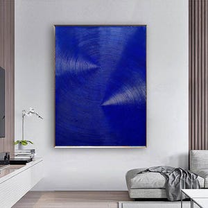May include: Abstract art print featuring a blue background with white concentric circles creating a swirling pattern.