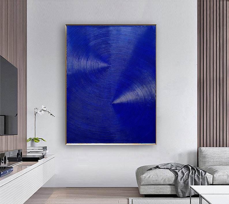 May include: Abstract art print featuring a blue background with white concentric circles creating a swirling pattern.