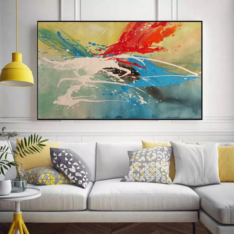 May include: Abstract painting with splashes of red, blue, green, and white paint on a yellow background.