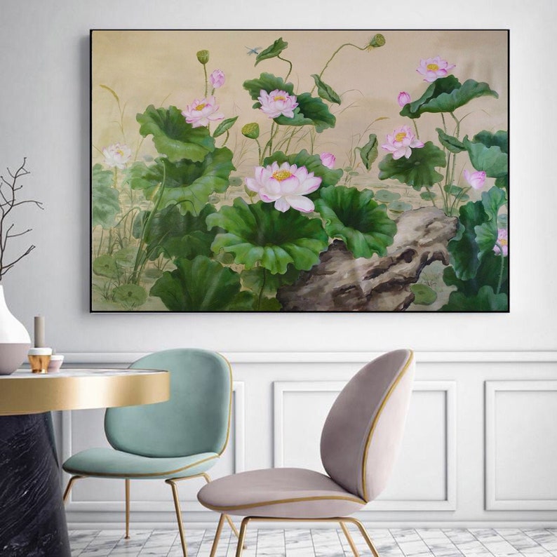 May include: A painting of pink lotus flowers with green leaves and a brown rock in the foreground. The background is a light beige color.
