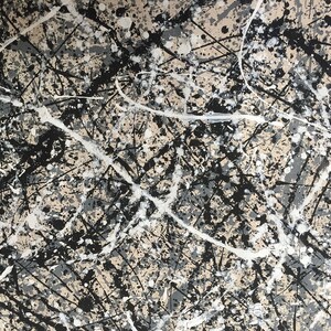 May include: Abstract painting with black, white and grey paint splatters and lines on a beige background.