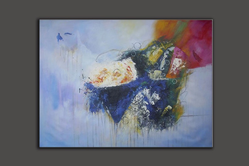May include: Abstract painting with a blue, green, white, orange, and pink color scheme. The painting features a large, dark blue and black shape in the center, surrounded by smaller shapes and splashes of color.