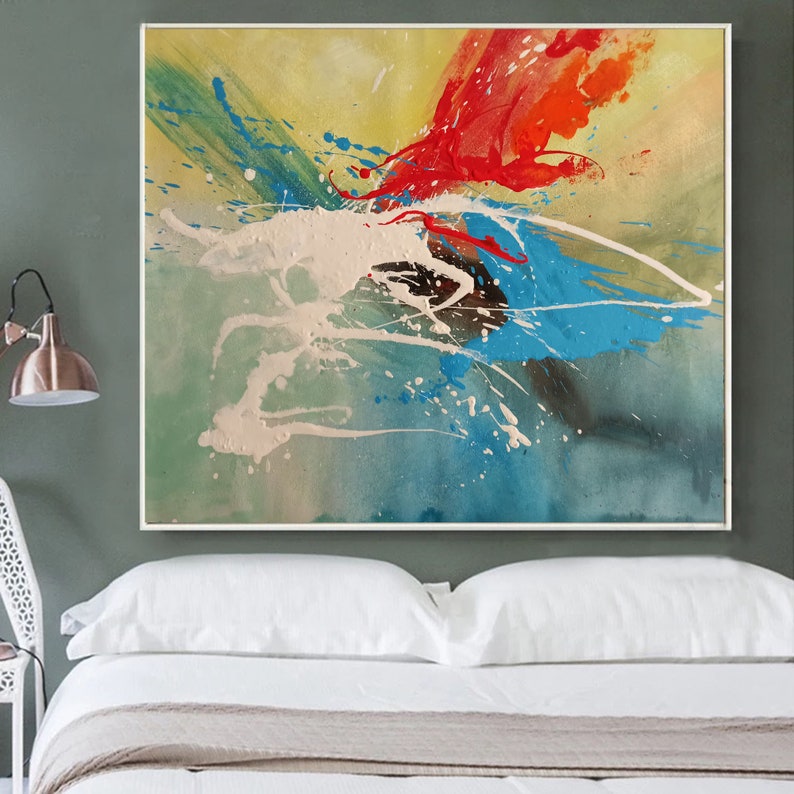 May include: Abstract painting with splashes of red, blue, green, and white paint on a yellow background.