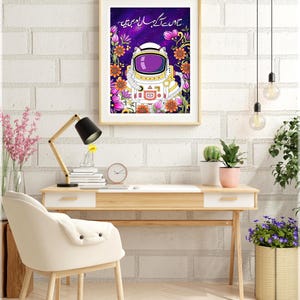 Framed Urdu poetry wall art displayed above a modern desk in a bright home office, showing scale and styling for a contemporary interior.