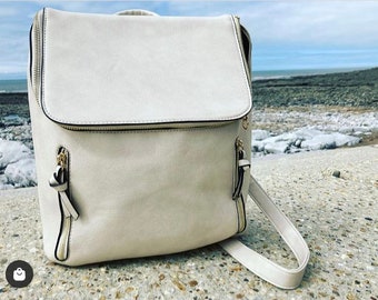 cream backpack purse