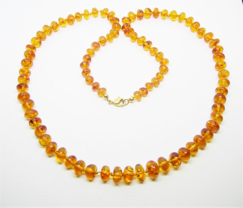 White red and gold necklace in rockery beads