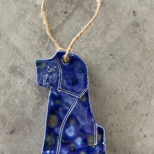 Hanging dog decoration in ceramic