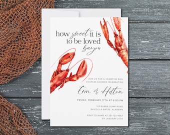 May include: White invitation card with watercolor illustrations of red crawfish. The text reads "how sweet it is to be loved bayou" and invites guests to a crawfish boil couples shower. Details include date, time, and location.