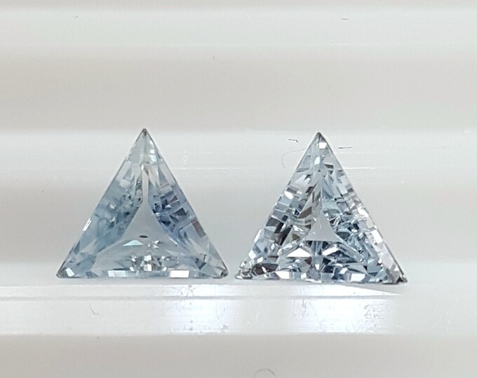 Couple of natural light blue sapphire, trillion/triangle mm.6,26x6,26x6,26, h.mm.2,97, weight cts.1,69