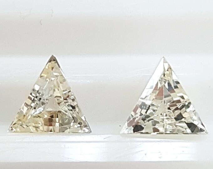 Couple of natural yellow sapphire, faceted trillion/triangle mm.6,30x6,30x6,30, h.mm.3,84, weight cts.1,78