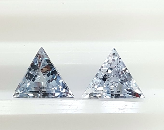 Couple of natural light blue sapphire, faceted trillion/triangle mm.5,90x5,90x5,90. h. mm.3,27, weight cts.1,61