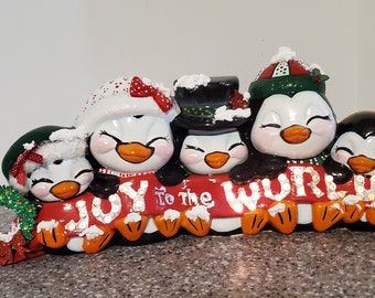 Penguins "Joy to the World" Ceramic Piece. Brings Joy to any group of friends or family. Price includes Shipping and Light cord.