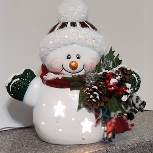 Ceramic Snowman dressed to help celebrate this Christmas season.  Shipping included in price.