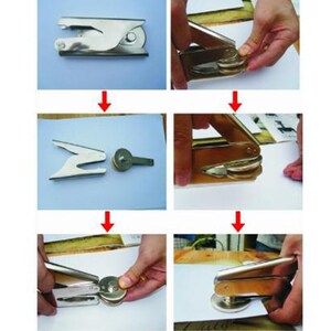May include: A silver metal stamp with a handle and a circular die. The stamp is shown in four steps: closed, open, being pressed down on paper, and closed again.