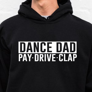 May include: Black hooded sweatshirt with white text that reads "DANCE DAD PAY-DRIVE-CLAP".