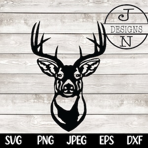 May include: Black silhouette of a deer head with large antlers against a woodgrain background.