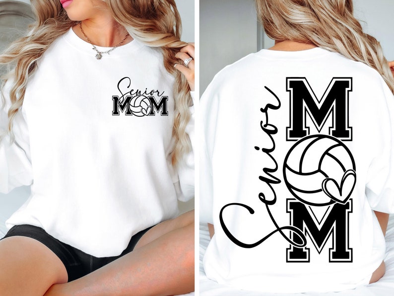 May include: White sweatshirt with black text that says "Senior Mom" with a volleyball graphic. The back of the sweatshirt has the text "Senior" in cursive and a large "M" with a volleyball and heart graphic.