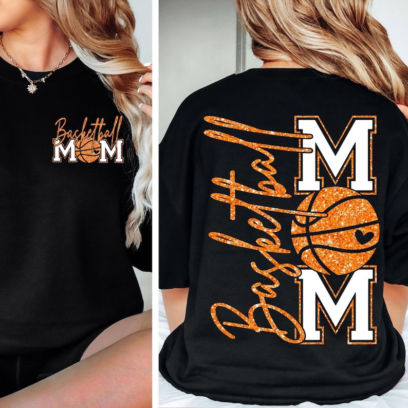 May include: Black sweatshirt with the text "Basketball Mom" in orange glitter lettering. The front features the text "Basketball Mom" with a basketball graphic. The back of the shirt has the words "Basketball" and "Mom" with a basketball graphic.