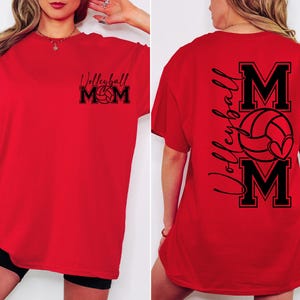 May include: Red t-shirt with black text that says "Volleyball Mom" on the front and "Volleyball MOM" with a volleyball and heart on the back.