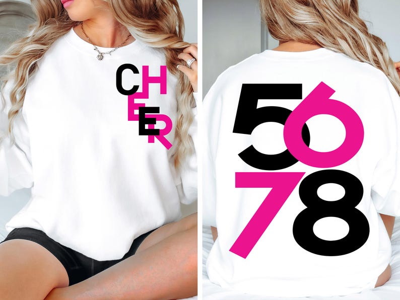 May include: White sweatshirt with black and pink text. The front of the sweatshirt says "CHER" in black letters with a pink outline. The back of the sweatshirt says "5678" with the numbers 5 and 7 in pink and the numbers 6 and 8 in black.