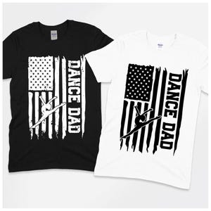 May include: Black and white t-shirts with a distressed American flag design, a dancer silhouette, and the text "DANCE DAD." The shirts are short-sleeved and made of a soft material. Ideal for dance fans.