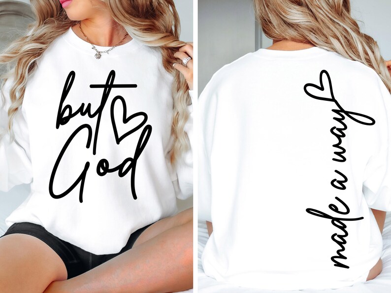 May include: White sweatshirt with the text "but God" and a heart on the front and the text "made a way" on the back.