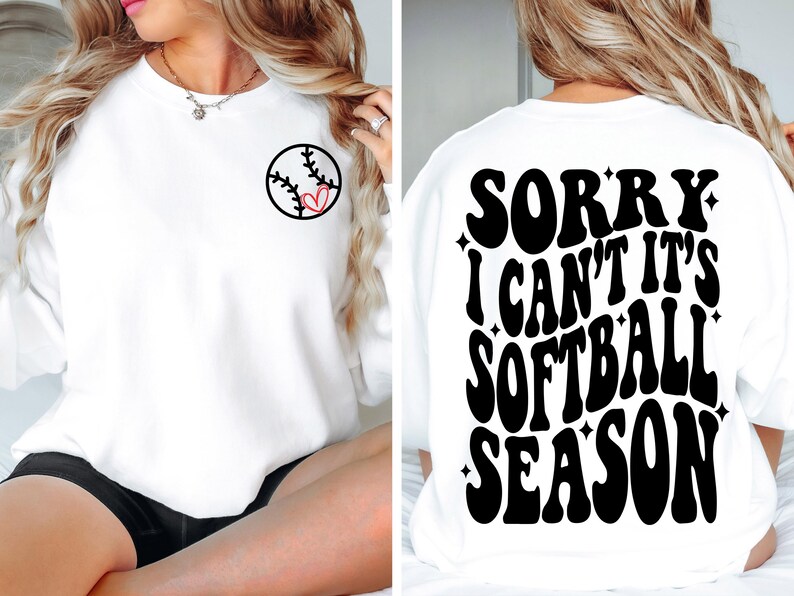 May include: White sweatshirt with a softball graphic on the front and the text "SORRY I CAN'T IT'S SOFTBALL SEASON" on the back.