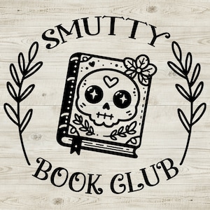May include: Black and white graphic featuring a book with a skull design, a heart, and floral accents. The text "SMUTTY BOOK CLUB" is arched above and below the book, surrounded by a leafy wreath, all set against a light wood grain background.