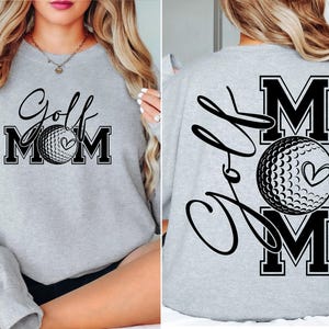 Może przedstawiać: Szara bluza z napisem "Golf Mom" i grafiką piłki golfowej z przodu. Z tyłu bluza ma napis "Golf Mom" z grafiką piłki golfowej.