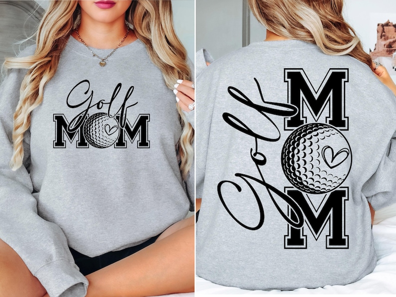 Może przedstawiać: Szara bluza z napisem "Golf Mom" i grafiką piłki golfowej z przodu. Z tyłu bluza ma napis "Golf Mom" z grafiką piłki golfowej.
