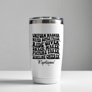 May include: White stainless steel tumbler with a black graphic that reads "Uniform Washer, Water Bottle Filler, Ride Giver, Snack Maker, Picture Taker, Sideline Cheer, #Sportsmom".