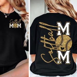 May include: Black crew neck t-shirt with gold glitter text and a softball design. The front of the shirt says "Softball Mom" with a softball graphic. The back of the shirt has a larger design with the words "Softball Mom" and a softball graphic.