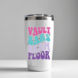 May include: White stainless steel tumbler with a pink, blue, and purple design that says "Vault Bars Beam Floor".