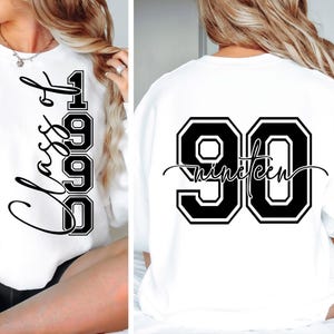 May include: White sweatshirt with black lettering. The front features the word "Class" and the number "1990". The back displays the number "90" with the word "Nineteen" in a script font.